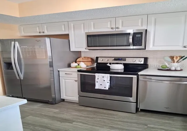 Photo 4 of Condo for sale at 4145 Heron Way #E-208, Bradenton, FL 34205 | MLS# O6437416 | Listing updated on 2026-09-04