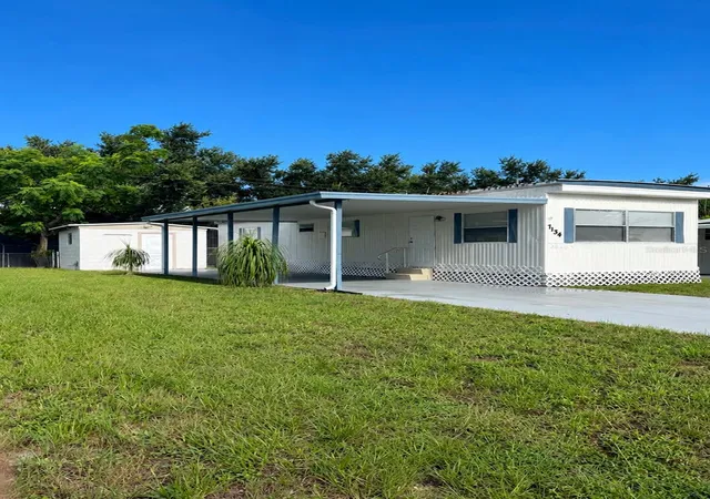 Photo 1 of Manufactured home for sale at 7134 Lofty Dr, Port Richey, FL 34668 | MLS# W7889047 | Listing updated on 2026-09-02