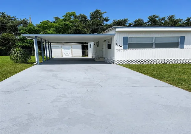 Photo 2 of Manufactured home for sale at 7134 Lofty Dr, Port Richey, FL 34668 | MLS# W7889047 | Listing updated on 2026-09-02