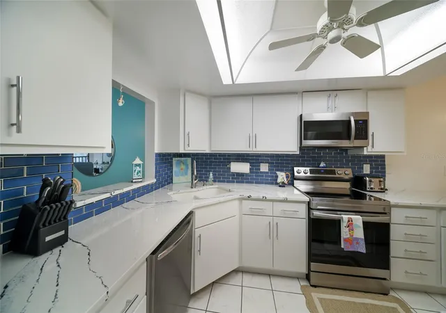 Photo 4 of Condo for sale at 3705 E Bay Dr #115, Holmes Beach, FL 34217 | MLS# A4704522 | Listing updated on 2026-09-17