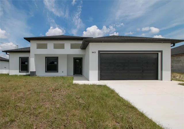 Photo 2 of Single family home for sale at 945 Commodore St, Lehigh Acres, FL 33974 | MLS# O6438060 | Listing updated on 2026-09-08