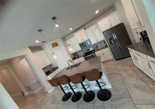 Photo 4 of Single family home for sale at 4310 Seven Canyons Dr, Kissimmee, FL 34746 | MLS# O6438327 | Listing updated on 2026-09-07
