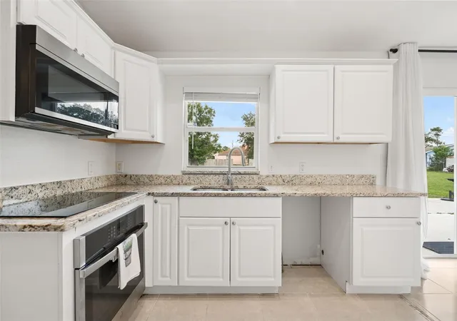 Photo 3 of Single family home for sale at 605 Tamarin Ln, Kissimmee, FL 34759 | MLS# O6438836 | Listing updated on 2026-10-02