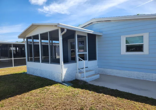Photo 3 of Manufactured home for sale at 8215 Caper Ln, Port St Lucie, FL 34952 | MLS# B26050179 | Listing updated on 2026-09-14