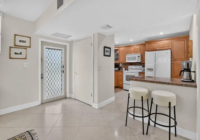 Photo 3 of Condo for sale at 2460 Deer Crk Country Clb Blvd #206-A, Deerfield Beach, FL 33442 | MLS# B26052596 | Listing updated on 2026-10-07