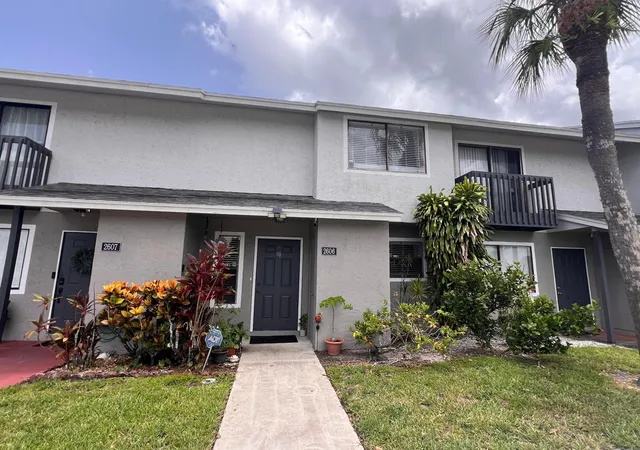 Photo 1 of Townhouse for sale at 2606 Canalside Dr, Greenacres, FL 33463 | MLS# B26054948 | Listing updated on 2026-09-14