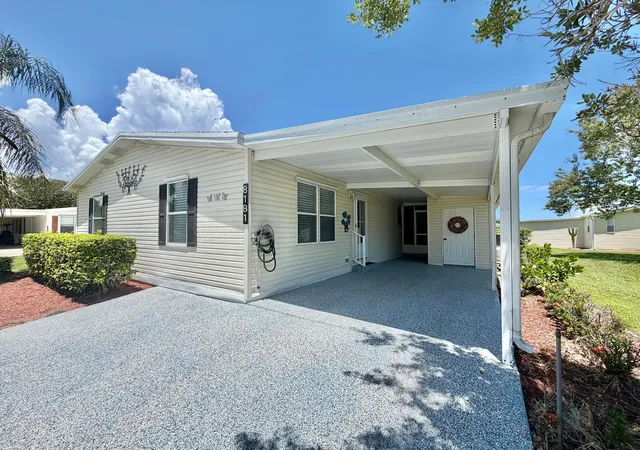 Photo 1 of Manufactured home for sale at 8181 14th Hole Dr, Port Saint Lucie, FL 34952 | MLS# B26060066 | Listing updated on 2026-09-14