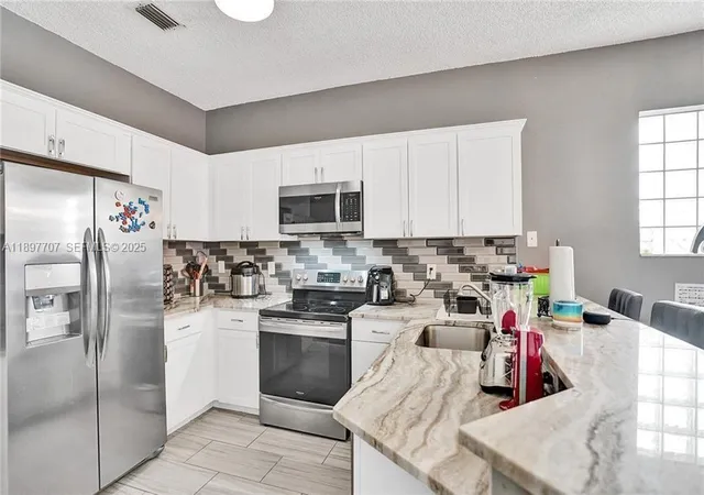 Photo 3 of Sale Pending at 4824 Nw 19th Street, Coconut Creek, FL 33063 | MLS# B26066297 | Listing updated on 2026-09-13