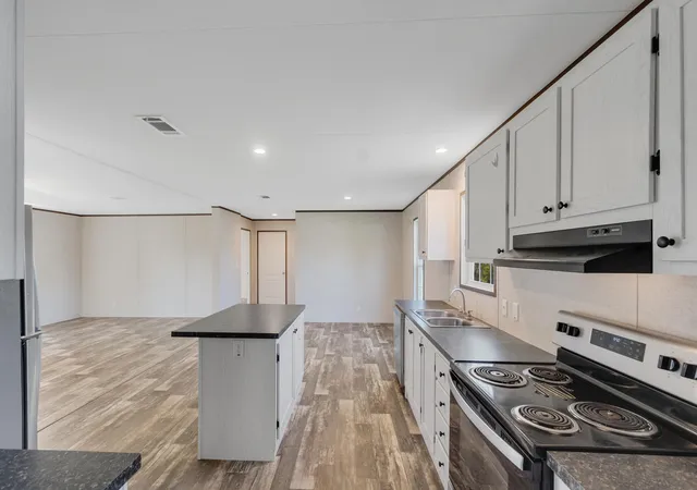 Photo 3 of Manufactured home for sale at 12980 80th Avenue, Sebastian, FL 32958 | MLS# B26076570 | Listing updated on 2026-09-15