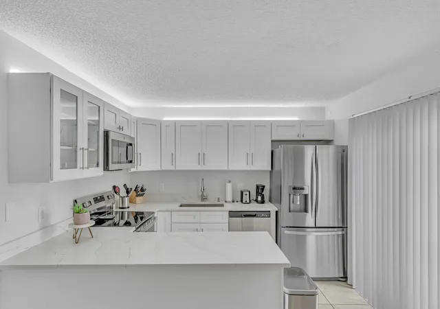 Photo 1 of Townhouse for sale at 2228 White Pine Cir #A, Greenacres, FL 33415 | MLS# B26076633 | Listing updated on 2026-10-07