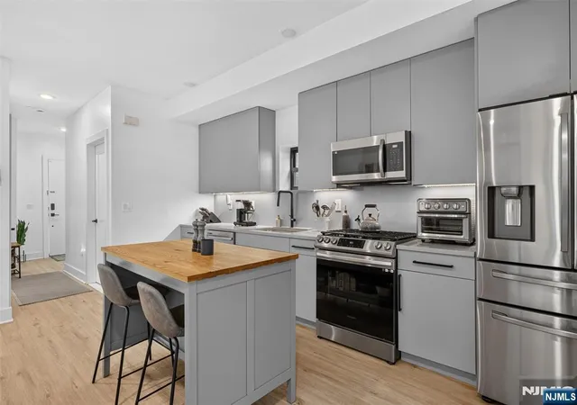 Photo 3 of Condo for sale at 56 Reservoir Ave #1, Jersey City, NJ 07307 | MLS# 26027217 | Listing updated on 2026-09-08