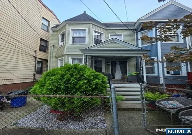 Single family home for sale at 825 Ridge St, Newark, NJ 07104 | MLS# 26037367