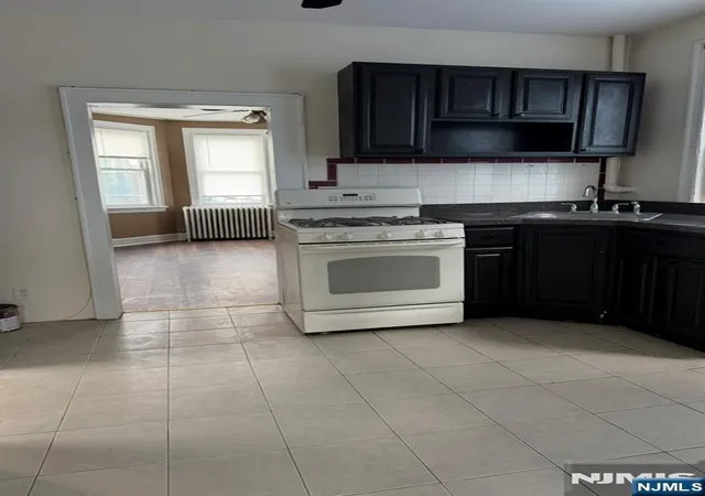 Photo 2 of Multi family home for sale at 124 Albion Ave, Paterson, NJ 07502 | MLS# 26038954 | Listing updated on 2026-10-18