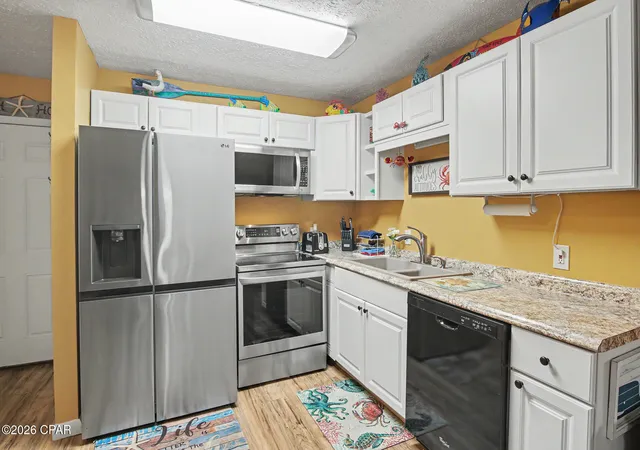 Listing Photo 4 - Condo for sale in building located at 7125 N Lagoon Dr, Panama City Beach, FL 32408 - Unit #C