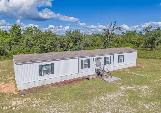 Photo 1 of Manufactured home for sale at 21835 Lake Mckenzie Blvd, Altha, FL 32421 | MLS# 795275 | Listing updated on 2026-09-11