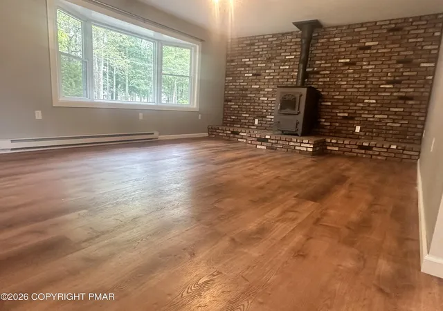 Photo 2 of Single family home for sale at 4107 Azalea Dr, Pocono Summit, PA 18346 | MLS# PM-144408 | Listing updated on 2026-09-03