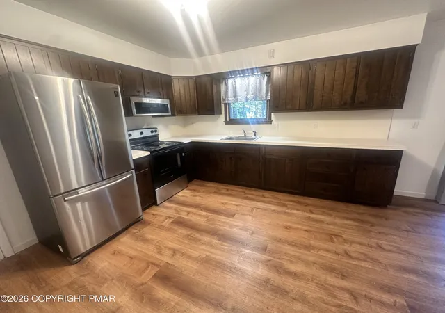 Photo 4 of Single family home for sale at 4107 Azalea Dr, Pocono Summit, PA 18346 | MLS# PM-144408 | Listing updated on 2026-09-03