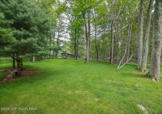 Photo 3 of Single family home for sale at 122 Tamarack Trl, Pocono Summit, PA 18346 | MLS# PM-144089 | Listing updated on 2026-10-16