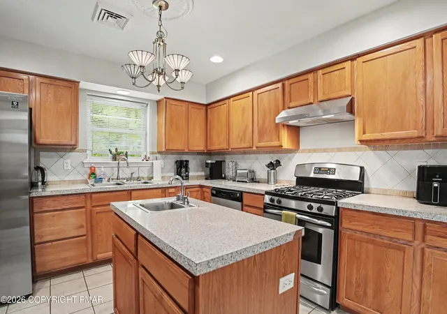 Photo 3 of Single family home for sale at 220 Nadine Blvd, Pocono Summit, PA 18346 | MLS# PM-144580 | Listing updated on 2026-09-09