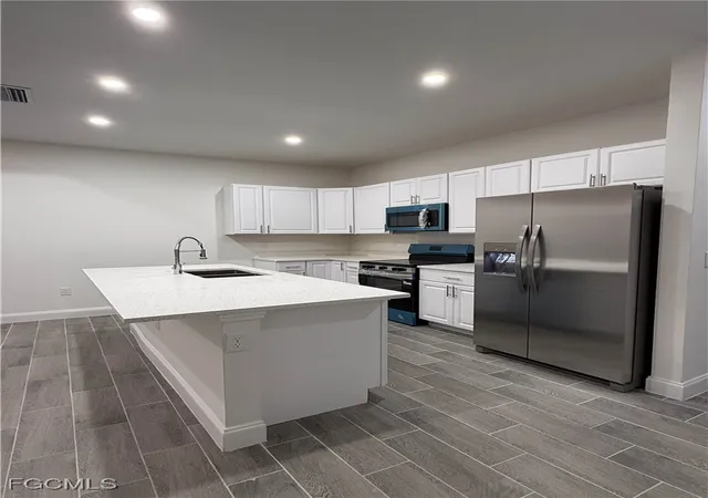 Listing Photo 4 - Condo for sale in building located at 317-319 Ichabod Ave, Lehigh Acres, FL 33973