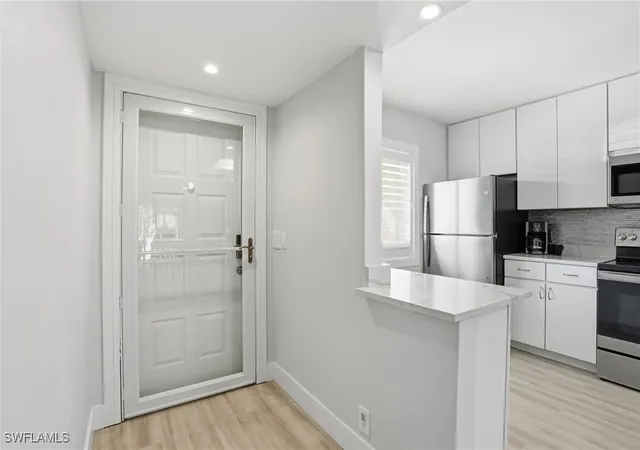 Listing Photo 5 - Condo for sale in building located at 7797 Esmeralda Wy, Naples, FL 34109 - Unit #K102