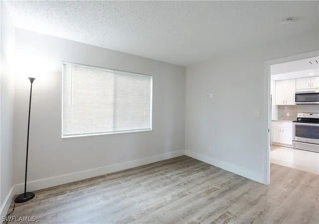 Listing Photo 3 - Condo for sale in building located at 123 Palm Dr, Naples, FL 34112 - Unit #2865