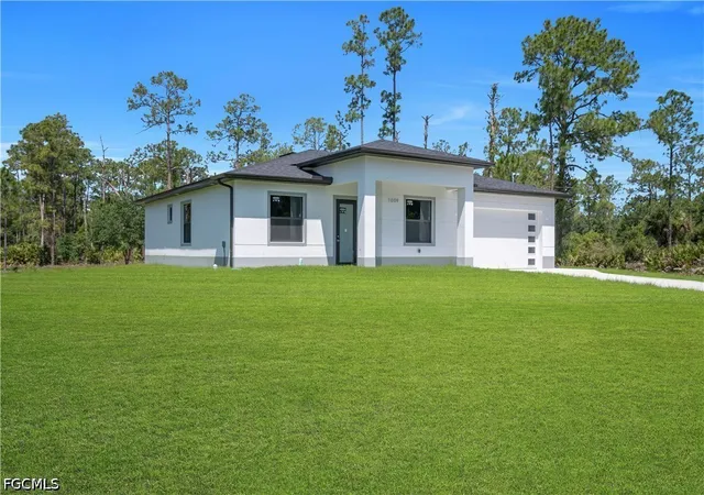 Photo 3 of Single family home for sale at 1009 Moore Ave, Lehigh Acres, FL 33972 | MLS# 2026018350 | Listing updated on 2026-09-02