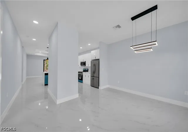 Photo 4 of Single family home for sale at 1009 Moore Ave, Lehigh Acres, FL 33972 | MLS# 2026018350 | Listing updated on 2026-09-02