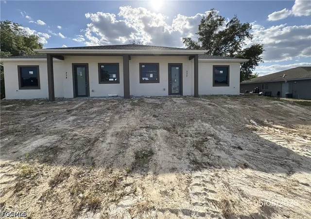 Photo 1 of Multi family home for sale at 332/334 Gilbert Ave S, Lehigh Acres, FL 33973 | MLS# 2026019717 | Listing updated on 2026-09-09