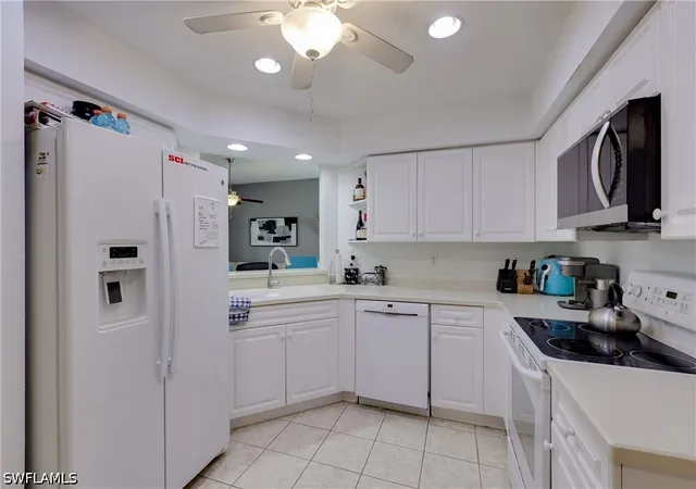 Listing Photo 4 - Condo for sale in building located at 25080 Peacock Ln, Naples, FL 34114 - Unit #102