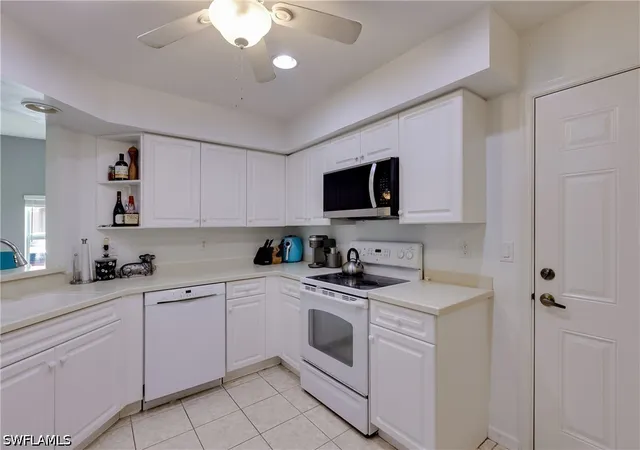 Listing Photo 5 - Condo for sale in building located at 25080 Peacock Ln, Naples, FL 34114 - Unit #102