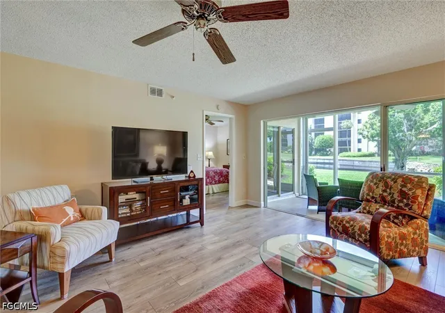 Listing Photo 3 - Condo for sale in building located at 9900 Sunset Cvs Ln, Fort Myers, FL 33919 - Unit #114