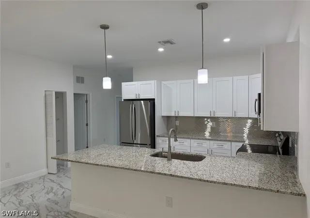 Listing Photo 5 - Condo for sale in building located at 5249-5251 Centennial Blvd, Lehigh Acres, FL 33971