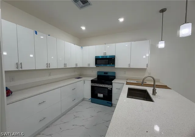 Listing Photo 2 - Condo for sale in building located at 3969-3971 Sunset Rd, Lehigh Acres, FL 33971