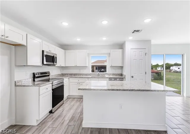 Photo 3 of Single family home for sale at 1242 Echard St E, Lehigh Acres, FL 33974 | MLS# 2026027663 | Listing updated on 2026-10-29
