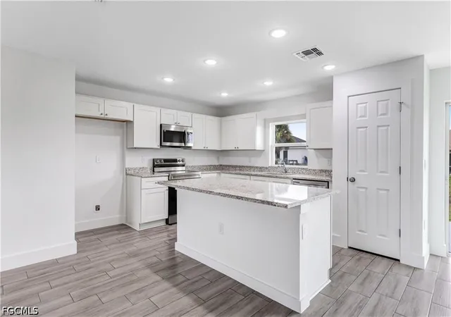 Photo 4 of Single family home for sale at 1242 Echard St E, Lehigh Acres, FL 33974 | MLS# 2026027663 | Listing updated on 2026-10-29