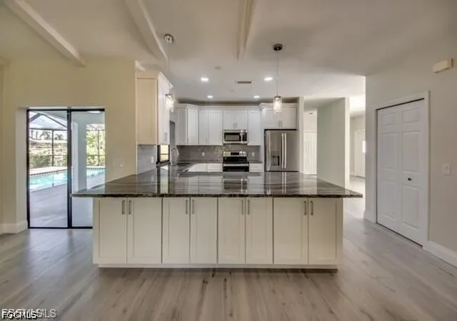 Photo 3 of Single family home for sale at 711 SE 33rd Terrace, Cape Coral, FL 33904 | MLS# 2026028575 | Listing updated on 2026-09-04