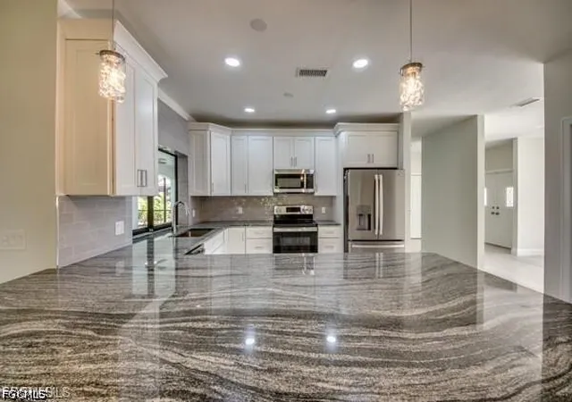 Photo 4 of Single family home for sale at 711 SE 33rd Terrace, Cape Coral, FL 33904 | MLS# 2026028575 | Listing updated on 2026-09-04