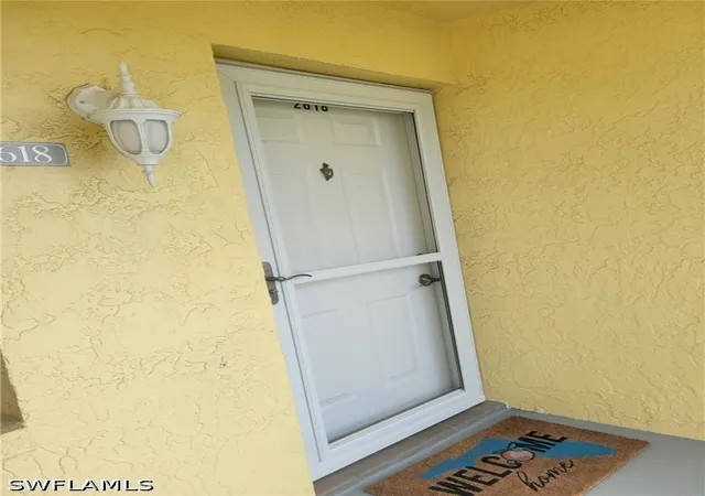 Listing Photo 4 - Condo for sale in building located at 2618 Kings Lake Blvd, Naples, FL 34112 - Unit #2-202
