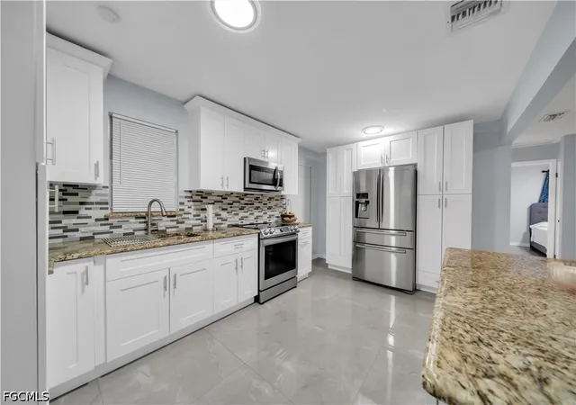 Photo 4 of Single family home for sale at 77 Glenmont Dr W, North Fort Myers, FL 33917 | MLS# 2026034832 | Listing updated on 2026-10-04