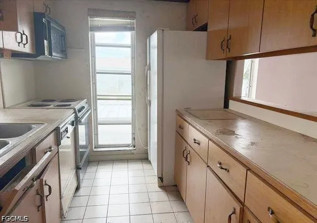 Photo 3 of Condo for sale at 330 Tudor Dr #203, Cape Coral, FL 33904 | MLS# 2026037368 | Listing updated on 2026-09-03