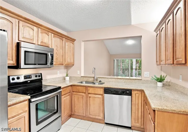 Listing Photo 5 - Condo for sale in building located at 749 Landover Cir, Naples, FL 34104 - Unit #203