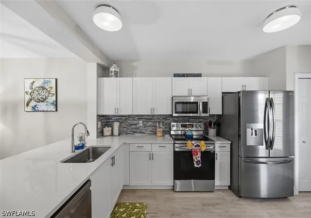 Listing Photo 4 - Condo for sale in building located at 9165 Celeste Dr, Naples, FL 34113 - Unit #103
