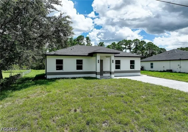 Photo 1 of Single family home for sale at 940 Lakeside Dr, Lehigh Acres, FL 33974 | MLS# 2026038788 | Listing updated on 2026-09-16