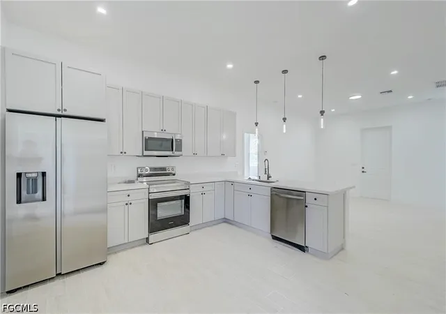Photo 3 of Single family home for sale at 940 Lakeside Dr, Lehigh Acres, FL 33974 | MLS# 2026038788 | Listing updated on 2026-09-16