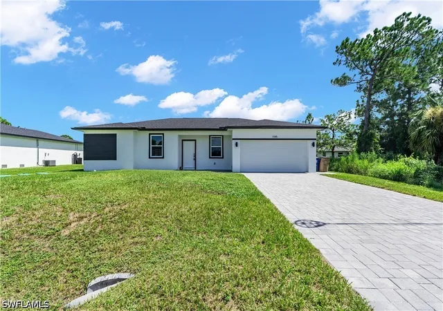 Single family home for sale at 1045 Norfolk Ave S, Lehigh Acres, FL 33974 | MLS# 226033298