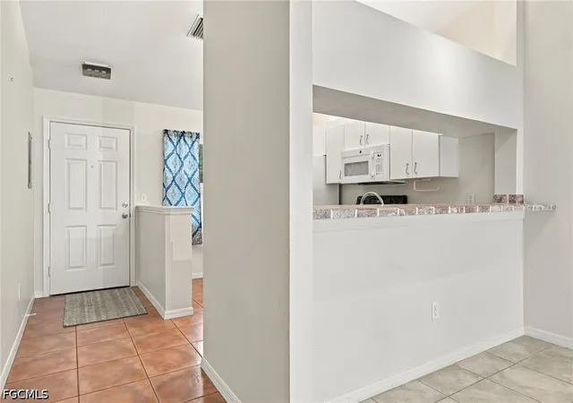 Listing Photo 1 - Condo for sale in building located at 14471 Lakewood Trace Ct, Fort Myers, FL 33919 - Unit #202