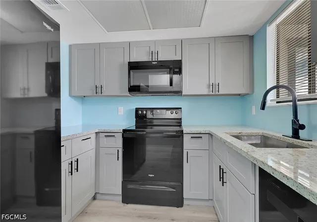 Listing Photo 1 - Condo for sale in building located at 1055 Palm Ave, North Fort Myers, FL 33903 - Unit #214