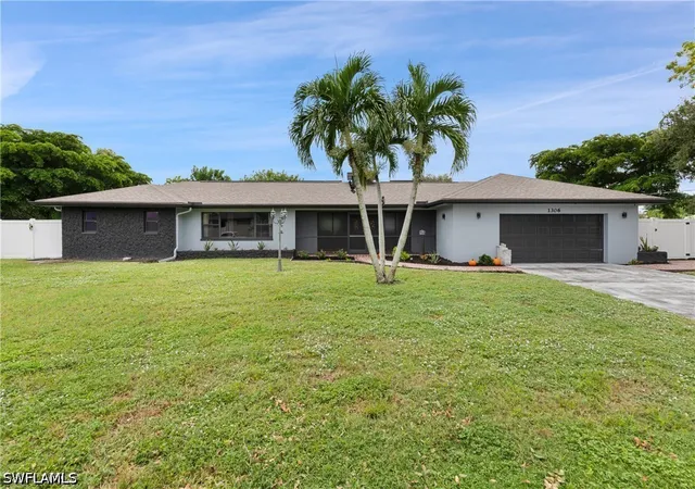 Single family home for sale at 1306 SE 12th Street, Cape Coral, FL 33990 | MLS# 226034714
