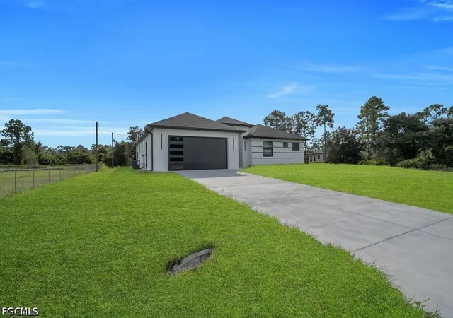 Photo 1 of Single family home for sale at 1704 Clayton Ave, Lehigh Acres, FL 33972 | MLS# 2026042733 | Listing updated on 2026-10-12